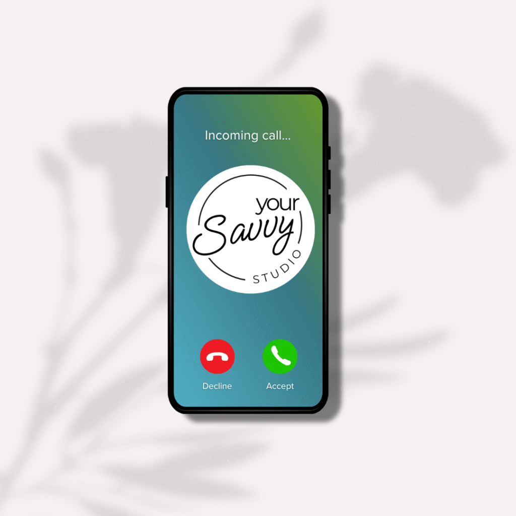 Image of a mock-up iphone displaying the call screen and the Your Savvy Studio logo. the background is a shadow of a plant.
